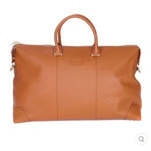 Brand new with tags. 100% leather weekend bag. 2 belts included. Gold hardware